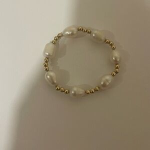 Gold toned and faux pearl beaded bracelet​​​​​​​​​​​​